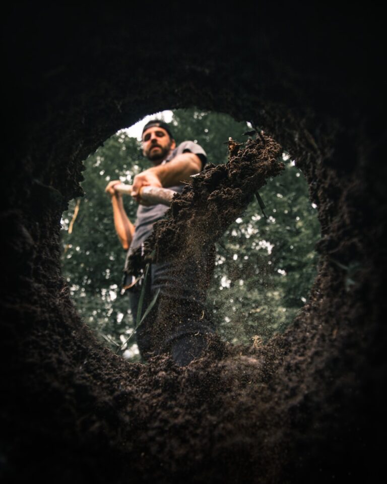 man standing near hole